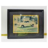 ramed photograph depicts a 1954 Chevrolet