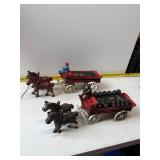 Pair of cast iron horse-drawn beer wagons