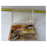vintage plastic tackle box with various lures