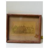 photograph of school children in a wooden frame.