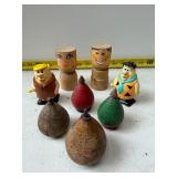 Wooden figures and plastic flintstone toys