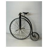 metal model of an 1870s-style High wheel bike