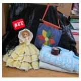 2 blankets, yellow doll, sewing bag, coffee mug