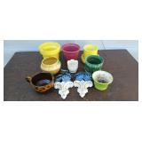 Assorted ceramic flower pots and chalk decor