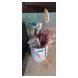 Canister with kitchen utensils