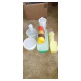 Assorted vintage Tupperware containers and cups