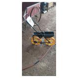 Garden seed row planter with seed and fertilizer