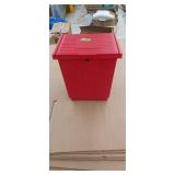 Red plastic loaded container 11' x 9' x 12'