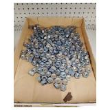 Flat of coated and uncoated 1/2'-13 nuts