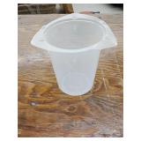 Approximately 69 32oz measuring cups