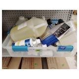 Tote of assorted cleaners and chemicals