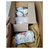 Porcelain pitcher and cups