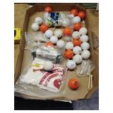 Flat of golf balls, tees, and golf items