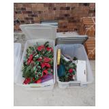 Two totes with lids with assorted Christmas decor
