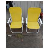 Two folding lawn chairs
