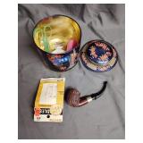 Tin with sewing supplies and vintage pipe