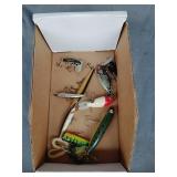 Vintage fishing lures, including jitterbug and