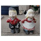 Vintage dutch kissing boy and girl concrete statue