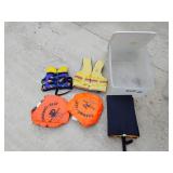 Tote with lid, kids life jackets, seat cushions