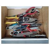 Pliers, tin snips, adjustable wrench,