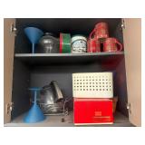 Contents of Cabinet, cups , tins,