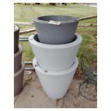 Stack of 3 plastic flower pots