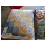 Three Patchwork Quilts in Various Patterns and Col