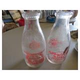 Two Vintage Dairy Milk Bottles with Red Graphics