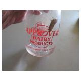 Two Vintage Dairy Milk Bottles with Red Graphics