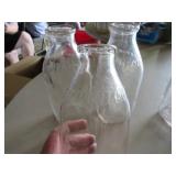 Six Vintage Embossed Glass Milk Bottles Featuring