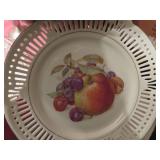 Two Decorative Plates: Fruit-Themed Ceramic and Fl