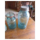 Four Mason Jars with Lids in Various Styles and Si