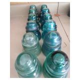 Glass Insulators in Various Shades of Blue and Gre