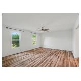 Spacious Primary Bedroom with Updated Flooring and Natural Light
