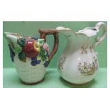 Two Decorative Handled Pitchers