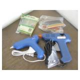 Two Working Glue Guns With Some Glue Sticks