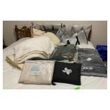 2 ZIPPERED BAGS OF BLANKETS  ( ONE WEIGHTED)