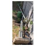 2 RADIO ANTENNAS THAT ARE ON THE GROUND
