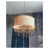 CRYSTORAMA BRENTWOOD CHANDELIER FEATURES A GOLD FINISH AND A TRADITIONAL DRUM SHADE