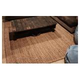 Sissel 8x10' Wooven Area Rug. In The Basement