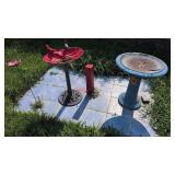 Red cardinal plastic bird bath, concrete blue