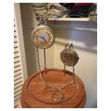 pocket watch in glass dome ,  front door closet