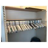 closet full of plastic hangers  master bedroom