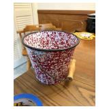 red speckled pail with handle 7' tall x 6' wide