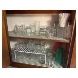 2 shelves of clear drinking glasses  & divider