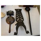 cast iron boot jack, ladle, footed pan, match
