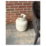 empty propane tank back porch