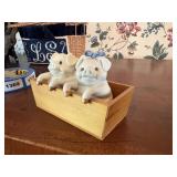 pig salt n peppers in wood trough  dining room