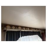 all gold trimmed china pieces above front window