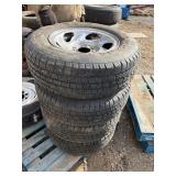 (4) Michelin P235/70R16 tires w/ 5 lug ford rims